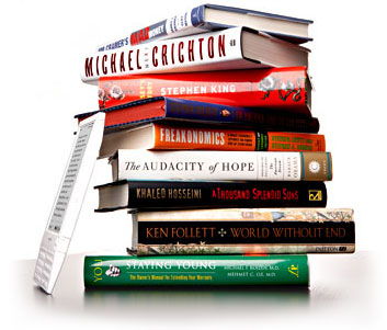 stack of books and an ereader