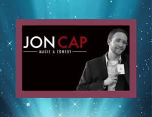 Logo and picture of Magician Jon Cap, Magic and Comedy, on a black background with a burgundy frame and a blue spotlight.