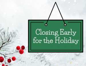 A green sign that says, "Closing Early for the Holiday," on a snowy background with a red berry bush.