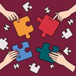 Four hands putting together a puzzle.