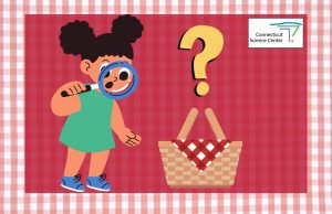 A young girl with a magnifying glass looking at a picnic basket with a large question mark above it.