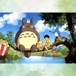 Image of movie My Neighbor Totoro and a smiling box of popcorn. A stream scene with animals and children fishing.