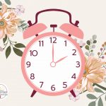 A pink clock at 2:00 PM on a background of flowers.