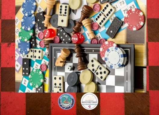 A checkerboard with a myriad of game board pieces, including dice, chips, and chess pieces.