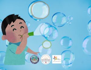 A boy blowing bubbles.