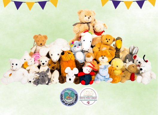 A big pile of stuffed animals sitting together under a parade swag.