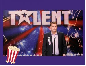 A photo of Paul Potts standing under the word TALENT.